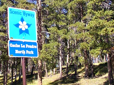 Entrance sign for Cache La Poudre-North Park Scenic Byway