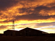 Sunset behind Church steeple photo thumbnail