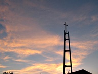 Sunset behind Church steeple photo thumbnail