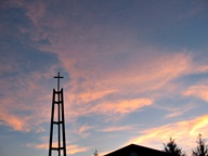 Sunset behind Church steeple photo thumbnail