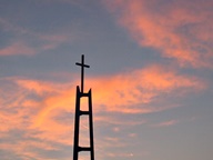 Sunset behind Church steeple photo thumbnail